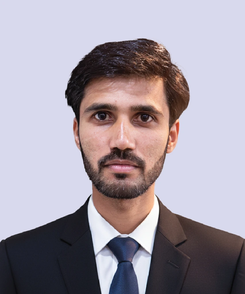 Professional portrait of Qadeer Ahmed, AI Engineer at VisionTact, in formal business attire.